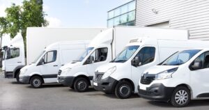 Various parked white vans
