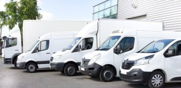 Various parked white vans