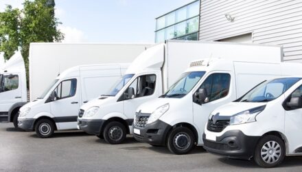 Various parked white vans