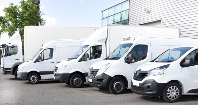 Various parked white vans