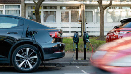 Electric car parked on the road being charges