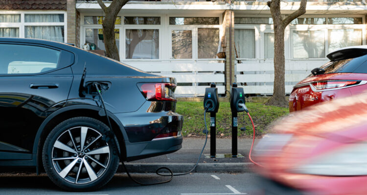 Electric car parked on the road being charges