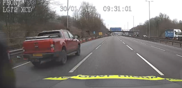Truck jumping a rolling road block on the M6