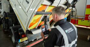 Technician maintaning a tipper