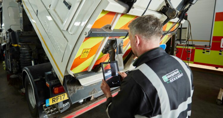 Technician maintaning a tipper
