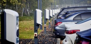 Parked electric cars being charged