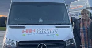 Rebecca Hall standing next to a HH Driveright van
