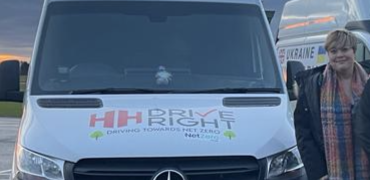 Rebecca Hall standing next to a HH Driveright van