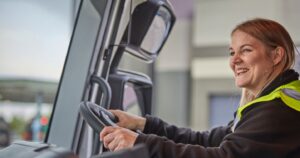 Smiling female HGV driver
