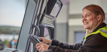 Smiling female HGV driver