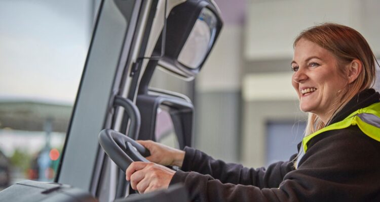 Smiling female HGV driver