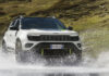 The Jeep Avengerxe driving through a river
