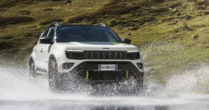 The Jeep Avengerxe driving through a river