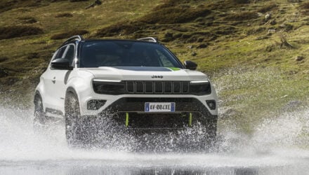 The Jeep Avengerxe driving through a river