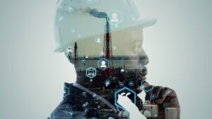 Worker wearing a hard hat superimposed on an industrial site
