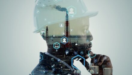Worker wearing a hard hat superimposed on an industrial site