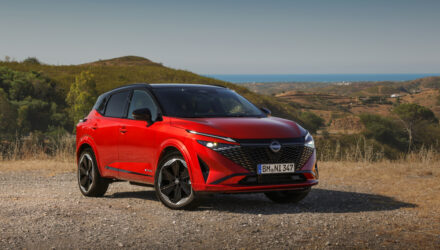 New refreshed Qashqai 2024 in fuji sunset color parked beside the road in Faro, Portugal