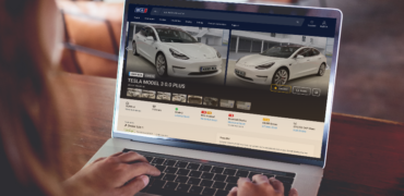 A laptop showing an electric vehicle available for purchase