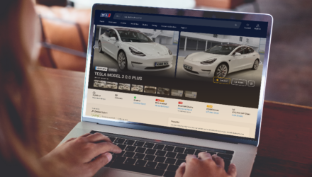 A laptop showing an electric vehicle available for purchase