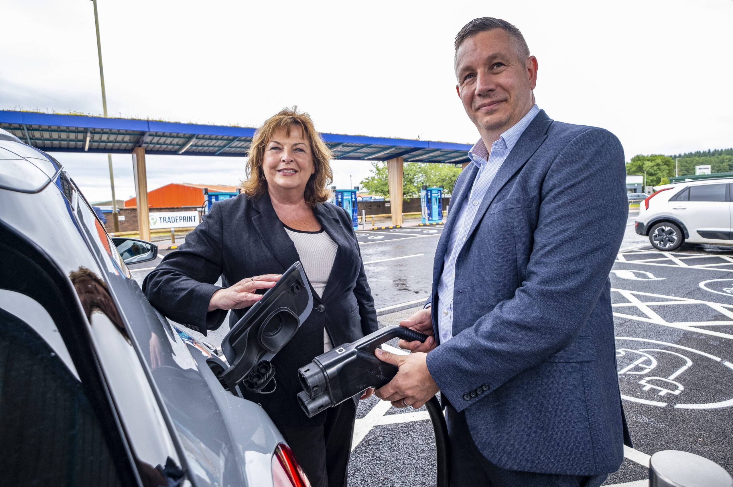 Simon Cowling, Lead Director, EV at SSE Energy Solutions, with Fiona Hyslop, Scottish Cabinet Secretary for Transport to the new Myrekirk EV Charging Hub in Dundee, Thursday 11 July 2024.