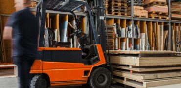 Fork-lift truck in a warehouse