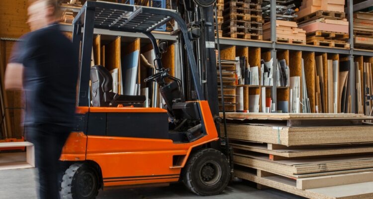 Fork-lift truck in a warehouse