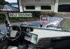Self driving truck with head up display on a road. Inside view.