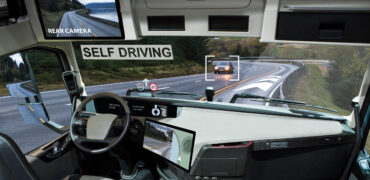 Self driving truck with head up display on a road. Inside view.