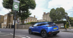 Blue Peugeot entering a ULEZ