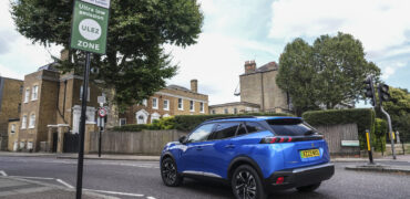 Blue Peugeot entering a ULEZ