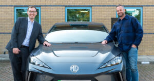 Tom Gordon MP and Will Voisey on either side of an electric MG