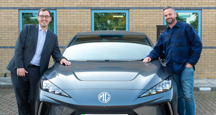 Tom Gordon MP and Will Voisey on either side of an electric MG