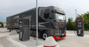MAN electric truck next to an E.ON Drive charging point