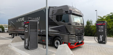 MAN electric truck next to an E.ON Drive charging point