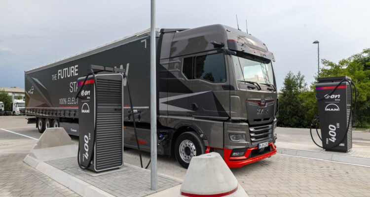 MAN electric truck next to an E.ON Drive charging point