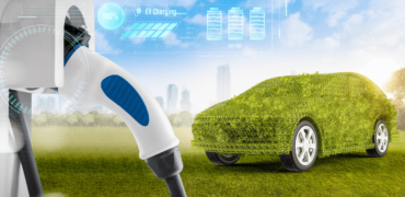 Green car at a charging point