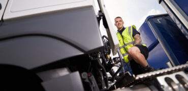 HGV driver checking his vehicle