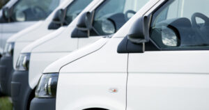 A row of white electric vans, LCV Market