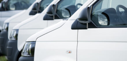 A row of white electric vans, LCV Market