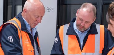 People in Hi-Vis looking at a document