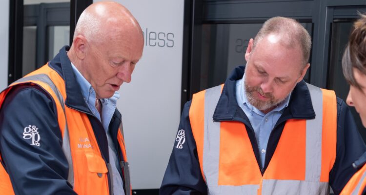 People in Hi-Vis looking at a document