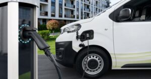 Whate van linked up to a public charging point