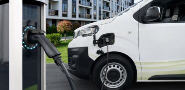 Whate van linked up to a public charging point