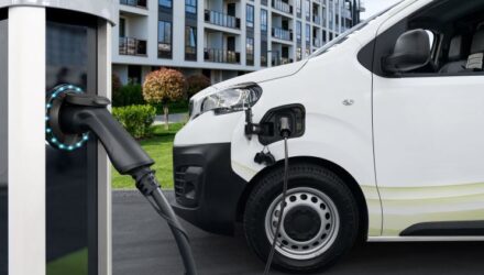 Whate van linked up to a public charging point
