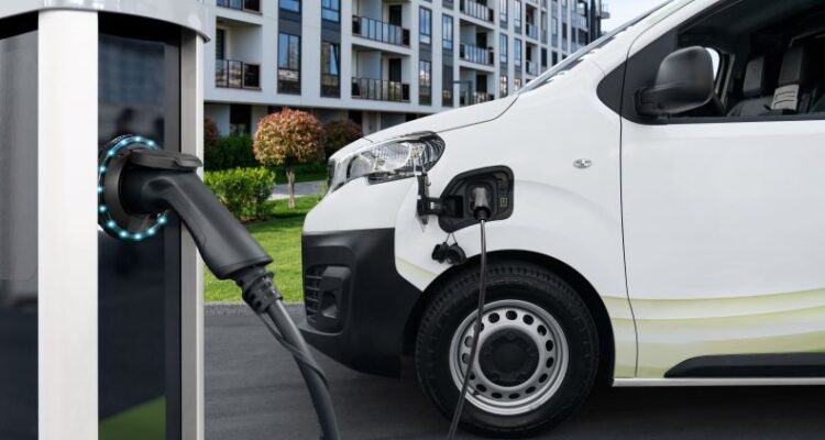 Whate van linked up to a public charging point