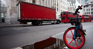 London street scene with bike lorry and buses