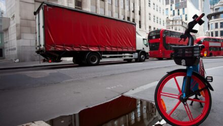 London street scene with bike lorry and buses