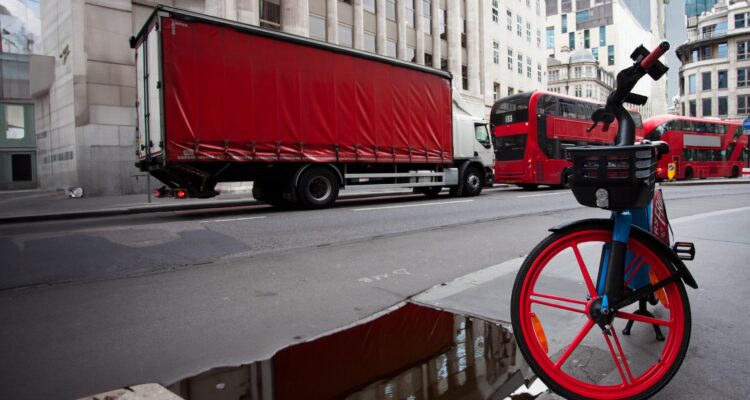 London street scene with bike lorry and buses