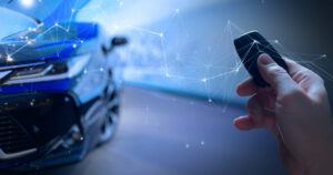 Car and person with key fob