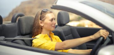 Young femail driver in her car